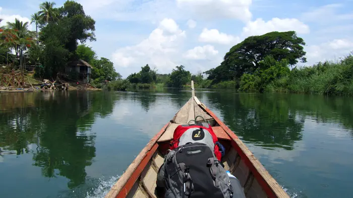 Traditional longtail boat crossing the Mekong to Don Det island, 4000 Islands, Laos